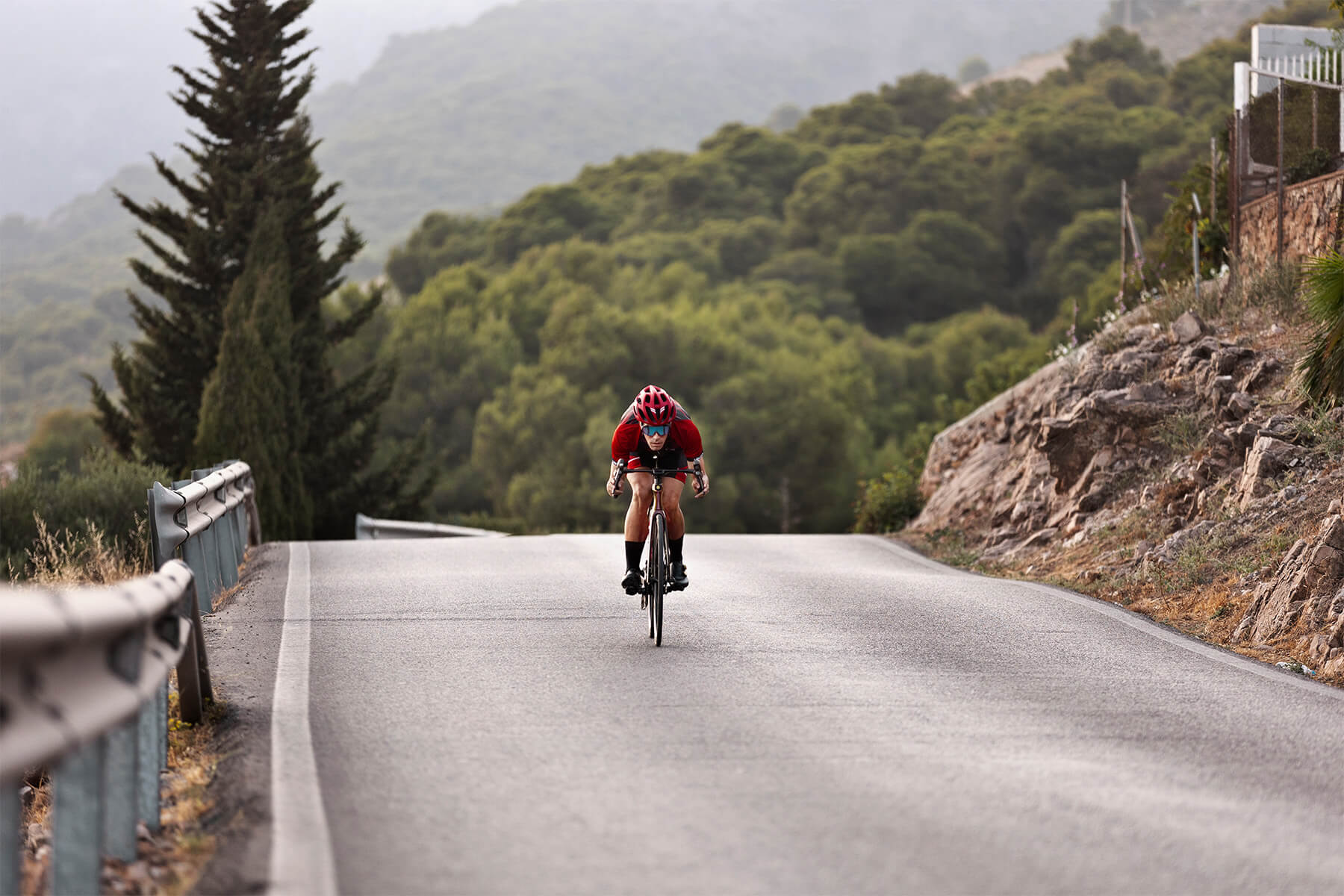 cyclist riding down a road in Austin, TX