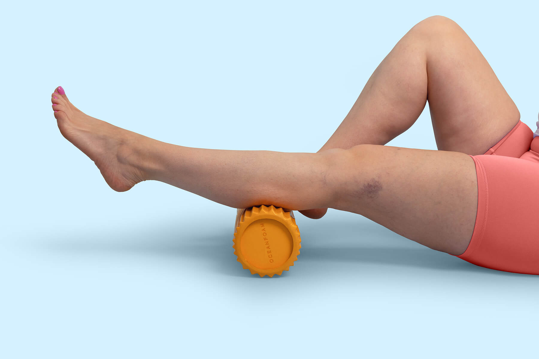 athlete using a calf roller for leg circulation