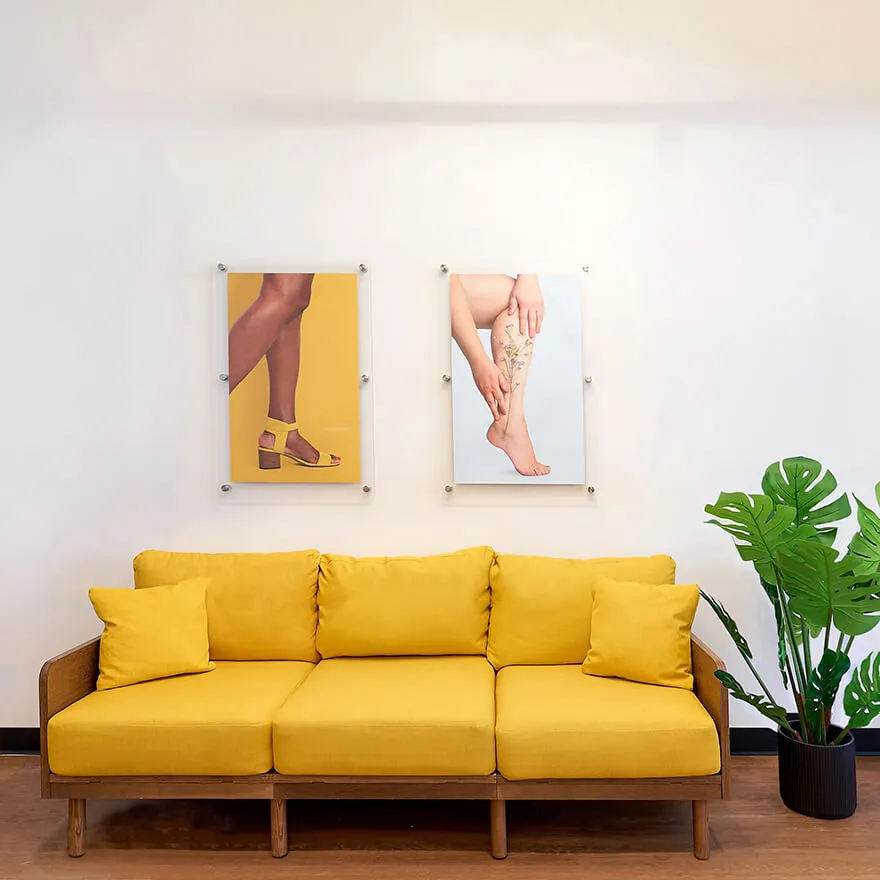 The couch and artwork in the waiting room of our vein clinic.